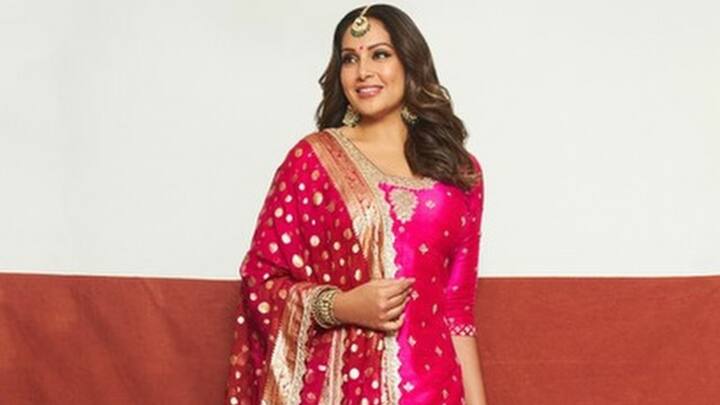 This bright sharara set had the funky gota work on the pink kurta and sharara, paired with a red Banarasi dupatta with scalloped edges. The vibrant pop of red added contrast and charm, making this outfit perfect for a celebration like a wedding or even a festival. (Image Source: Instagram/ bipashabasu)