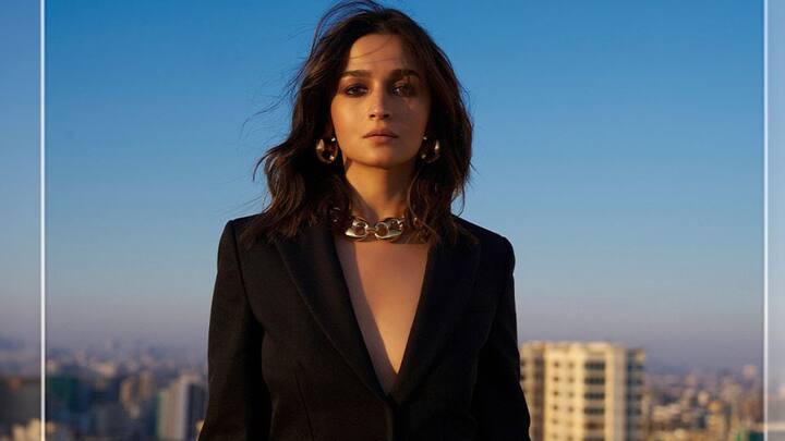 Alia nailed a chic formal look in an all-black pantsuit featuring a blazer with sharp lapels and wide-legged pants. Chunky gold accessories, including a chain necklace and earrings, added sophistication, while kohl eyes, nude lips, and loose curls completed her glamorous vibe.   (Image source: Instagram/ aliaabhatt)