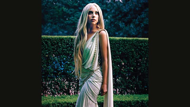 2. Lady Gaga: Lady Gana looked ethereal in a Tarun Tahiliani saree that was crafted from sleek jersey and paired with a cut out corset. The singer's saree had chain details and crystals. She had paired her look with a glamorous embellished blouse. (Image Source: Instagram/@taruntahiliani)