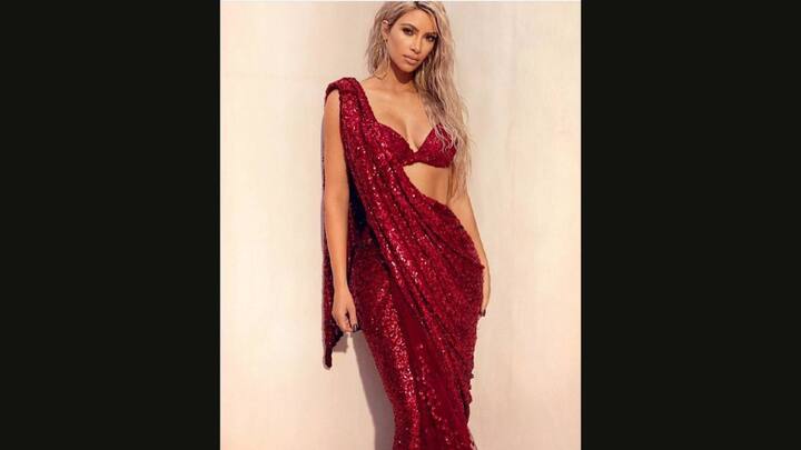 6. Kim Kardashian: Kim Kardashian looked daazling in her stunning signature red Sabyasachi saree. The saree has been created by 28 zardosi karigars from Kolkata. The Sabyasachi masterpiece has been hand embroidered on chiffon with metallic sequins and beads. (Image Source: Twitter/@FilmyGlamour)