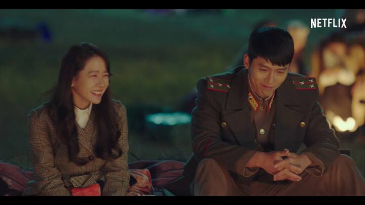 Crash Landing on You: Se-ri (Son Ye-Jin), a self-made CEO, discovers she’s the heir to her father’s company after his death. While paragliding to clear her mind, a tornado blows her into North Korea, where she meets Jeong-hyeok (Hyun Bin), a North Korean soldier, who must bring her back to the station.