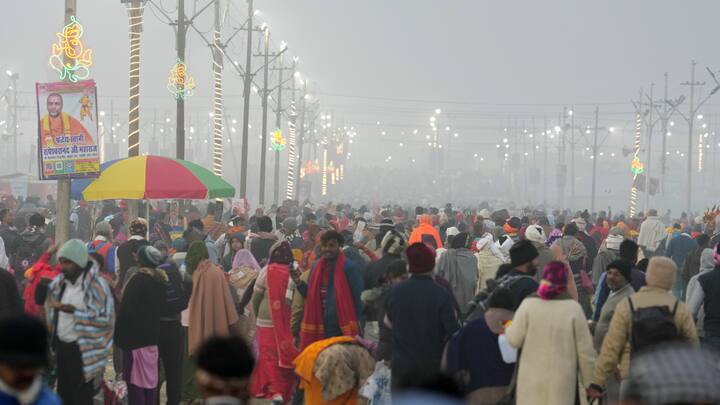 Devotees gather at Sangam to perform rituals on the first day of Maha Kumbh Mela 2025, in Prayagraj, Uttar Pradesh, Monday, Jan. 13, 2025.