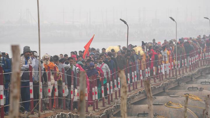 Devotees arrive on the first day of Maha Kumbh Mela 2025, in Prayagraj, Uttar Pradesh, Monday, Jan. 13, 2025.