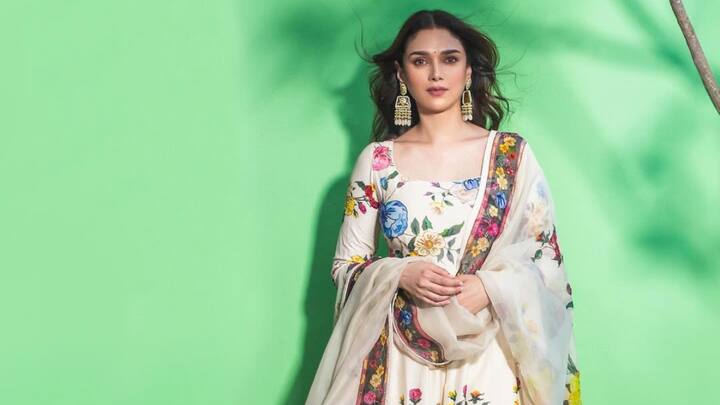 Aditi Rao Hydari looked ethereal in an ivory floral-printed Anarkali suit-set. She gave it an extra grace with an ivory see-through dupatta edged with small floral borders and adorned her ears with statement earr rings. (Image Source: Instagram/ aditiraohydari)