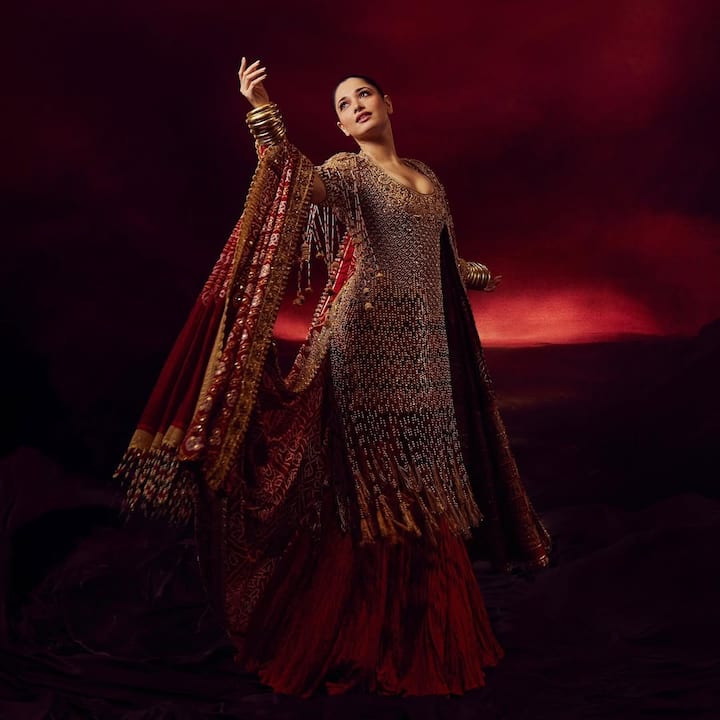 Pulling off a maximalist look requires a delicate balance of elements, and for ace designer duo Abu Jani Sandeep Khosla, it’s second nature. Recently, they chose Tamannaah Bhatia as their muse, dressing her in a breathtakingly embellished Bandhani kurta paired with a dupatta and a crushed silk skirt.