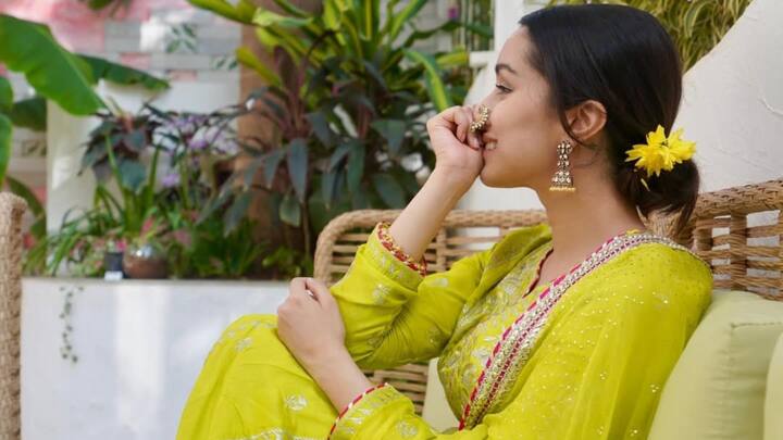 Shraddha Kapoor dressed herself in marathi style, with neon green colour Anarkali. Her long-sleeved panelled kurta-come-tunic featured intricate floral designs. It had a notched V-neck which the neon churidar was complemented by the neon dupatta finished off with golden embellishment and a striking pop of dark pink, channelling Marathi Mulgi, flawless. (Image Source: Instagram/ shraddhakapoor)