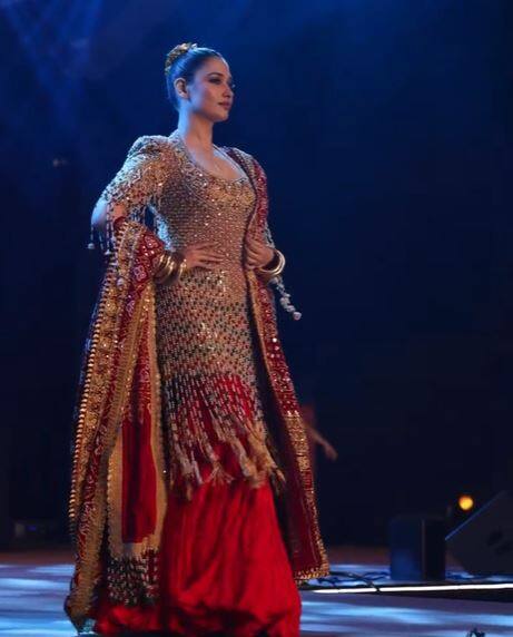 To balance the maximalism, the kurta was paired with a matching red crushed silk skirt and a Bandhani dupatta adorned with similar gold embroidery.