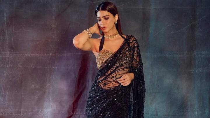 Kriti Sanon was sparkling in a black net saree with shimmering sequins and embellishments. She was styled in a halter-neck golden blouse and accessorised with a choker set and bangles. (Image Source: Instagram/ kritisanon)