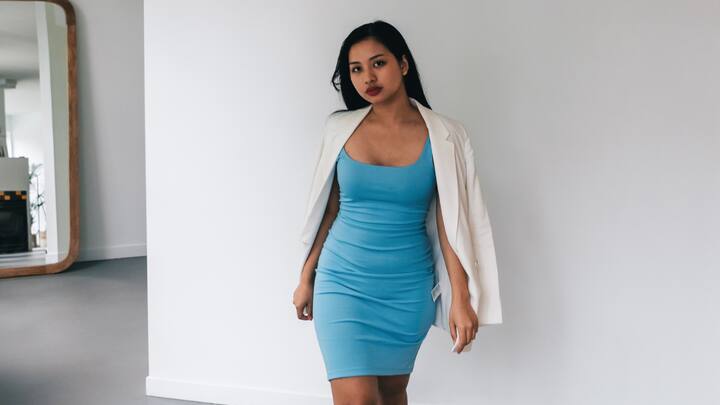 Bodycon Dress: The bodycon dresses have a fitting silhouette that gives an elongation to your curves. Made from stretchy material, these dresses look really sleek and confident and are a wow for great glamorous evenings. (Image Source: Canva)