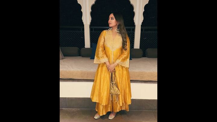 3. Sonakshi Sinha: Sonakshi Sinha's vibrant mustard yellow kurta set gives her a regal look. The actress has adorned her look with matching juttis and a potli bag. Her outfit has has stunning intricate embroidery work which enhances the traditional look. (Image Source: Instagram/@anitadongre)