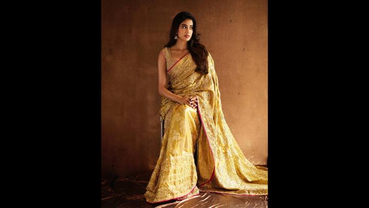 2. Jahnvi Kapoor: Janhvi Kapoor exudes timeless elegance in a luxurious Kanjivaram saree that has been embroidered with crystals. The actress has worn an antique gold sequin and signature metal sequin blouse which makes a radiant statement giving her a regal look. (Image Source: Instagram/@manishmalhotra05)