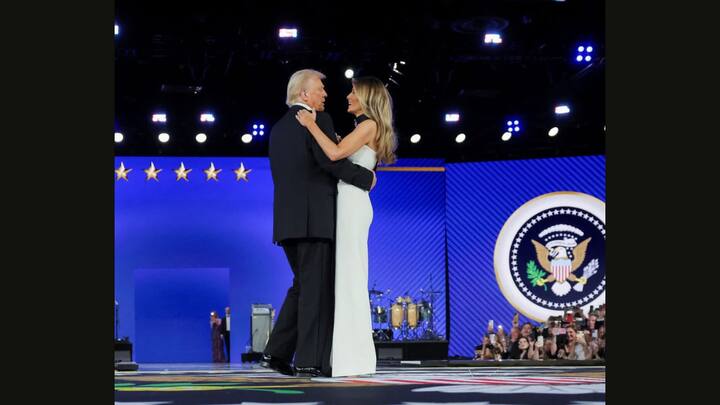 Melania Trump joined Donald Trump during the Inaugural Ball wearing a stunning floor length black and white gown. Her outfit has a thigh high slit and striking geometric zigzag patterns. (Image Source: Twitter/@NUH5544)