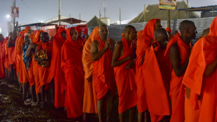 Newly initiated 'Naga Sadhus' of Shri Panchayati Akhara Niranjani wait in a queue to take blessings of 'Gurus' as part of their 'Diksha' ceremony during Maha Kumbh Mela 2025, in Prayagraj. (Photo: PTI)