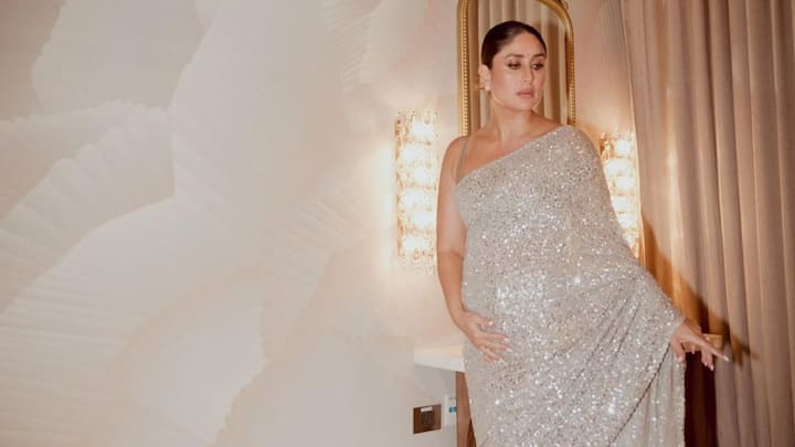 Kareena Kapoor has stunned all with a shining white shimmery saree embellished with glittering sequins throughout. Beige scoop-neck and backless blouse makes a very glamorous but eternal outfit for someone looking forward to shining in the evening event. (Image Source: Instagram/ kareenakapoorkhan)