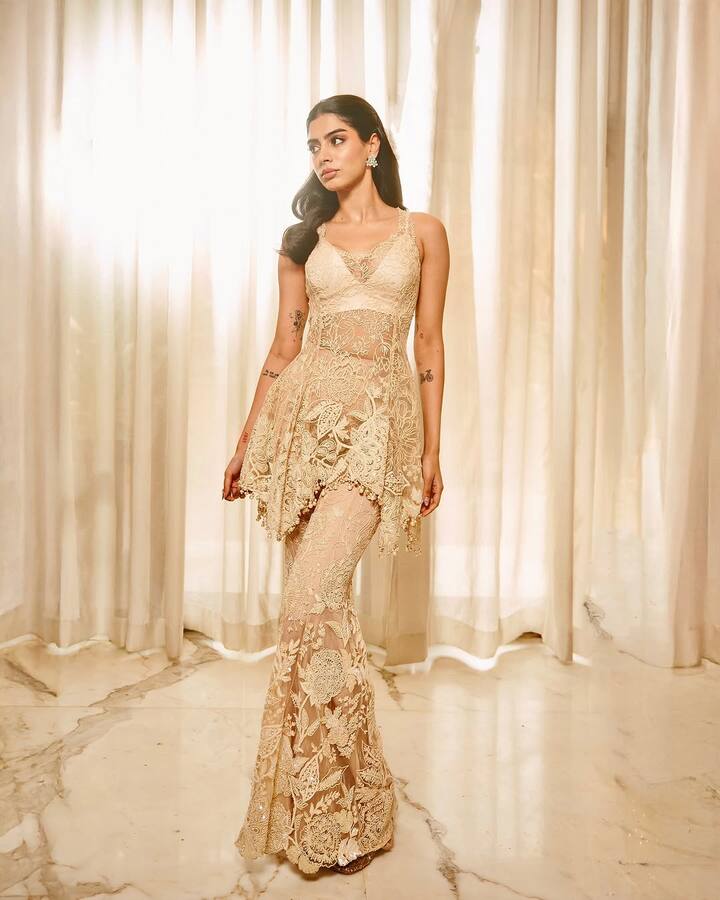 Khushi teamed the sheer embroidered top with a matching sharara.