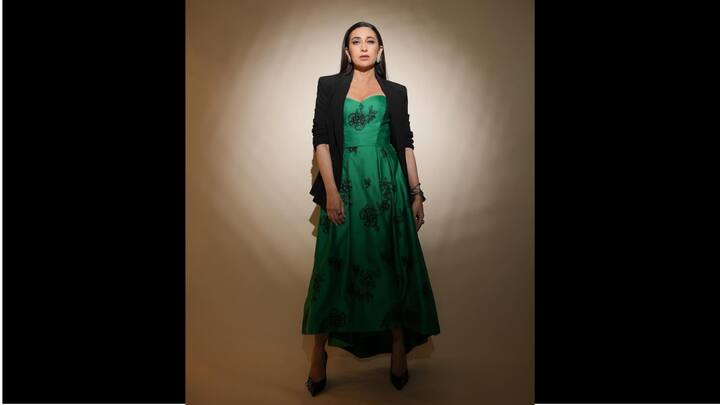 5. Karisma Kapoor: Karisma Kapoor looked exquisite in her green dress. The flared dress featured delicate black floral detailing and a sweetheart neckline. The actress paired her dress with a stylish black blazer which gave her a chic look. (Image Source: Instagram/@therealkarismakapoor)