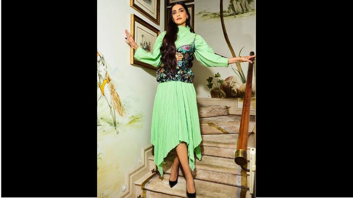 3. Sonam Kapoor: Sonam Kapoor looked flawless in a high neck, mid length neon green dress. She added a touch of floral flair to her outfit with a black corset with vibrant multicoloured floral designs which added elegance to her look. (Image Source: Instagram/@sonamkapoor)