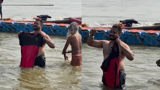 RCB  fans dips bengaluru jersey maha kumbh mela triveni sangam video gets viral