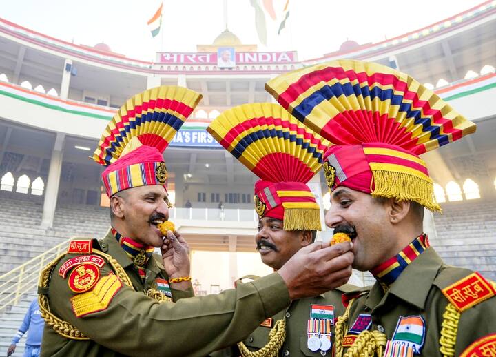 Border Security Force (BSF) personnel celebrate with sweets the 76th Republic Day Parade at the Attari-Wagah border near Amritsar, Sunday, Jan. 26, 2025. (PTI Photo)