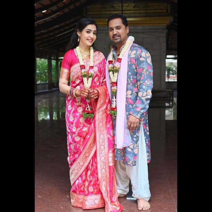 Nidhi, in a pink embroidered saree, and Sandiip, in a floral-printed kurta, are seen posing together in the wedding photos.