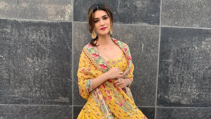 Kriti Sanon embraces a yellow crepe anarkali adorned with printed detailing, paired with silk bottoms and a printed crepe dupatta. This vibrant ensemble blends tradition with a contemporary charm. (Image Source: Instagram/ Kritisanon)