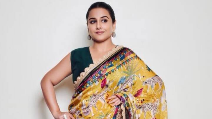 Vidya chose a very eye-catching black and yellow printed saree which is a nature-inspired, accompanied by a sleeveless blouse. She added a  twist in a funky scarf tied on her bun that combined vintage palate with chic modernity. (Image Source: Instagram/ balanvidya)