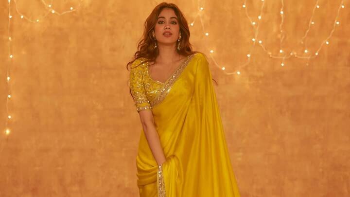 Janhvi embraced tradition in a classic yellow saree featuring intricate zari embroidery. The rich gold detailing and lightweight fabric made her look effortlessly ethereal. (Image Source: Instagram/ manishmalhotraworld)