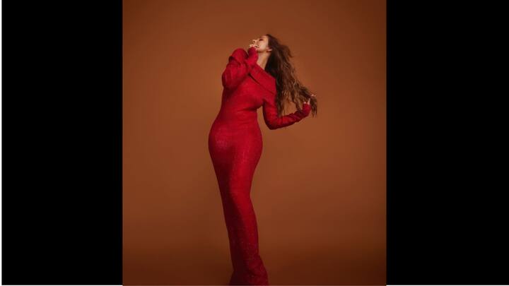 3. Malaika Arora: Malaika Arora stunned in a bright red bodycon gown. Her outfit had an off shoulder style and sequin detailing. The actress looked absolutely radiant in her attire with long sleeves and ankle length train. (Image Source: Instagram/@malaikaaroraofficial)