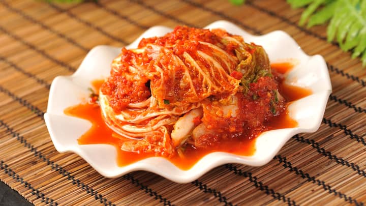 6. Kimchi: Fermented foods like Kimchi are a great source of probiotics that support gut health. A healthy gut improves the mental health by influencing the production of mood regulating neurotransmitters. (Image Source: Canva)