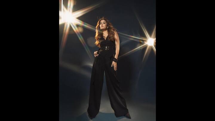 5. Black Monochromatic Co-Ord Set: Rasha made a bold statement in a sleeveless waistcoat and trouser set. She exuded confidence and elevated her look with a double buckle black leather belt. The actress embraced the all black ensemble from head to toe and embodied elegance. (Image Source: Instagram/@rashathadani)