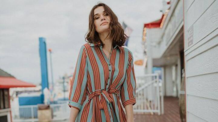 A shirt dress is a versatile pick for those who love a mix of comfort and style. Belt it at the waist for a flattering shape, and pair it with boots or heels for a sophisticated yet relaxed valentine's look. (Image Source: Canva)