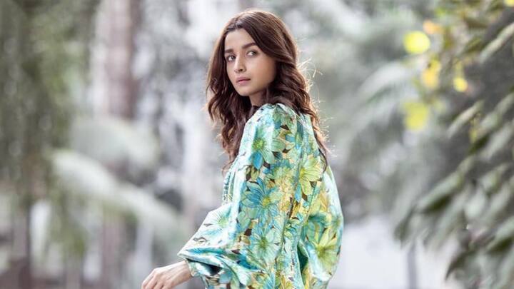 Alia Bhatt's floral printed dress with exaggerated sleeves is a dream outfit for the bold fashionista. The neon flash of colour livens it up to make it a glamorous statement piece for a romantic date on Rose day. (Image Source: Instagram/ aliaabhatt)