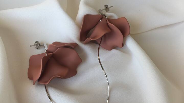Rose-Themed Earrings: Elegant and timeless, rose-themed earrings would give any outfit a romantic touch. These are beautiful keepsakes for the symbols of love and admiration. (Image Source: Canva)