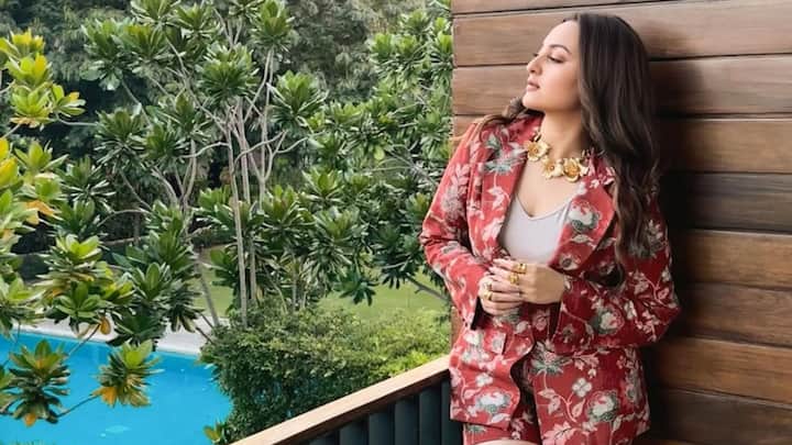 Sonakshi Sinha looks elegant in a red blazer and shorts set, flaunting a bold-yet-classy look. This power-packed outfit rounds off with a gold jewellery pairing for a confident and stylish Rose Day look.  (Image Source: Instagram/ aslisona)