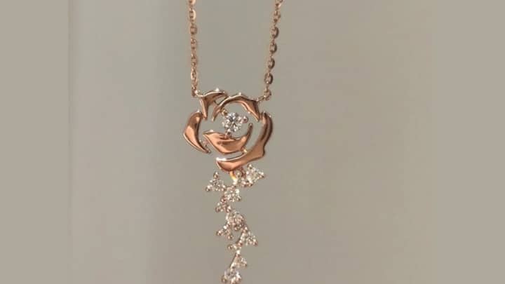Rose-Themed Pendant: A delicate rose pendant symbolises love and grace; therefore, it is one meaningful piece of jewellery. One can wear it really close to her heart. (Image Source: Pinterest/ vickywinwine)