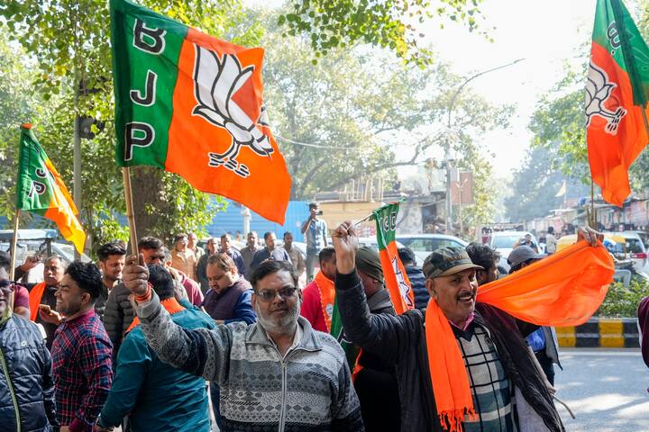 BJP supporters celebrate the party's lead in Delhi Assembly polls during counting of votes, in New Delhi, Saturday, Feb. 8, 2025. (Image Source: PTI)