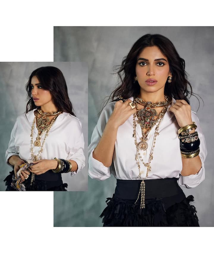 She wore a classic white shirt, which gave the outfit a crisp and fresh vibe, while the ruffle black skirt added a playful touch, giving her look a sense of movement and femininity. The combination of the two pieces created a striking contrast, showcasing her effortless style.