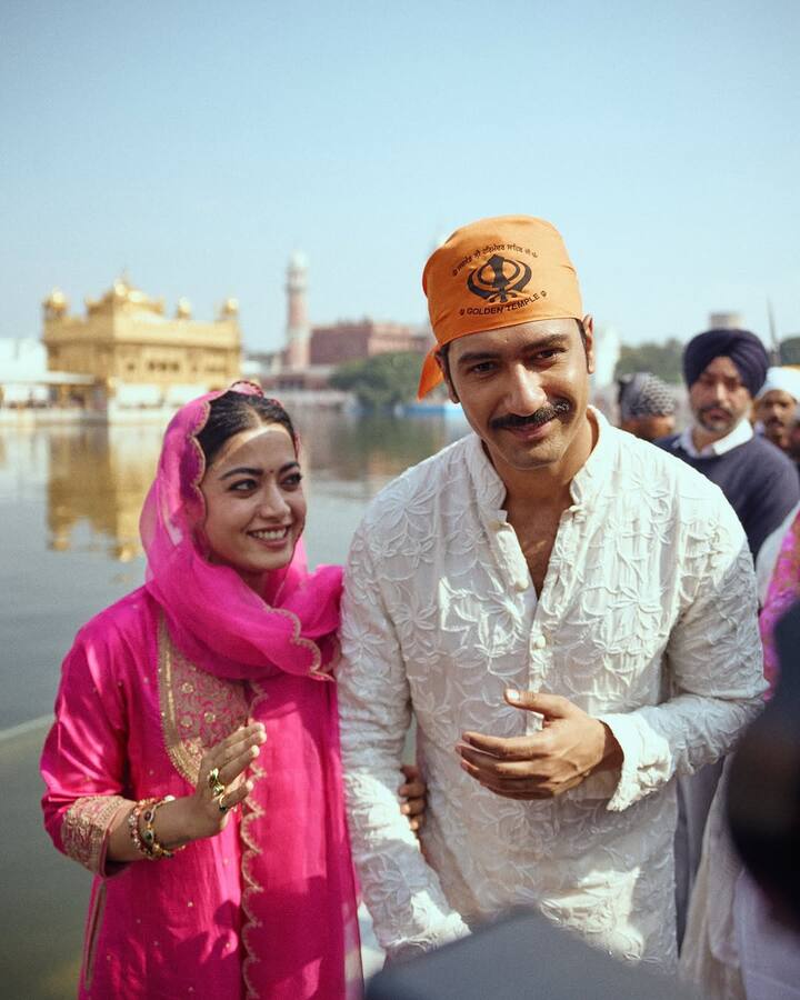 Rashmika was seen in a fuchsia pink ethnic suit and Vicky in a white kurta pyjama with an orange scarf.