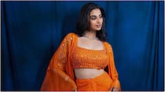 Meenaakshi Chaudhary : ఆరెంజ్ డ్రెస్​లో స్టన్నింగ్​గా ముస్తాబైన మీనాక్షి చౌదరి.. ఆమె ఫోజులు చూస్తే ఫిదా అవ్వాల్సిందే