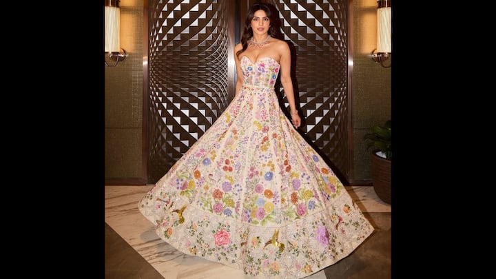 4. Floral Fairytale: Priyanka serves an ethereal look with her charming floral outfit. The actress's ensemble had vibrant hand embroidered flowers. She paired her outfit with a strapless silhouette and a flowy skirt that created a dreamy effect. She wore a luxurious and dazzling necklace that elevated her look. (Image Source: Instagram/@priyankachopra)