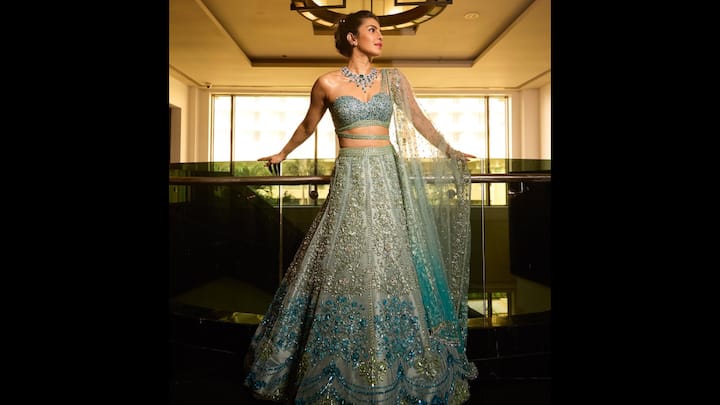 2. Aqua Blue Lehenga: The actress exuded grace in her traditional aqua blue lehenga. The heavily embellished outfit featured intricate work. Priyanka Chopra paired her look with a delicate sheer dupatta that enhanced her royal aura. She finished her traditional look along with statement jewellery. (Image Source: Instagram/@priyankachopra)