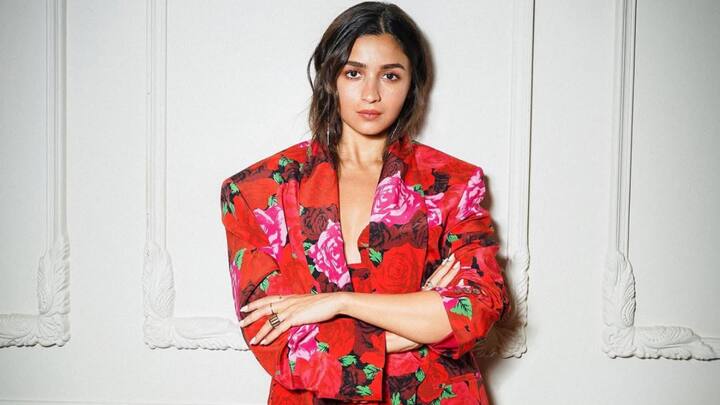 Alia Bhatt mixes vibrant florals with a red and pink rose-printed dress and oversized matching blazer. Red heels add flair to this playful yet graceful look, reeking of romance and confidence. (Image Source: Instagram/ aliaabhatt)