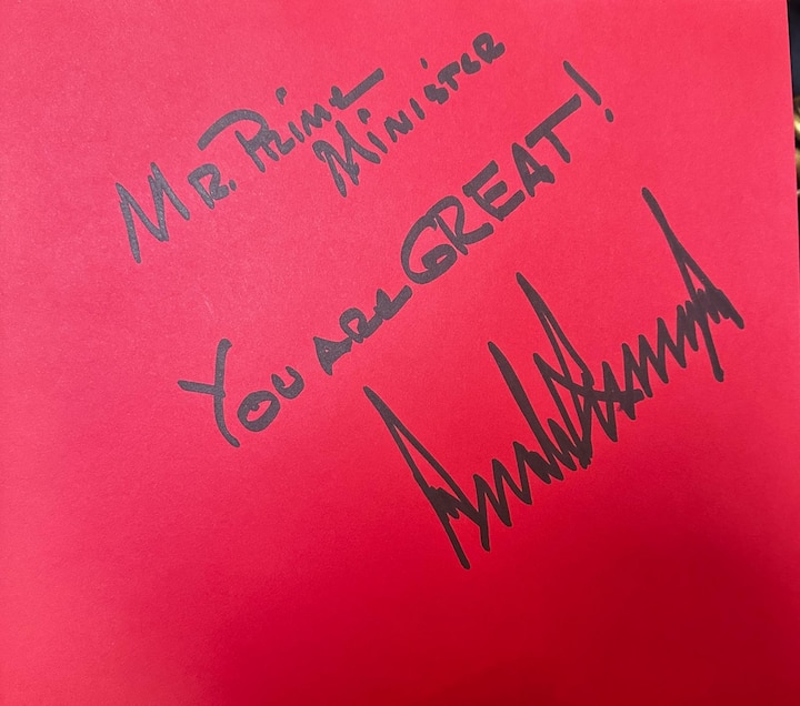 A handwritten note from Donald Trump to PM Modi reads, 