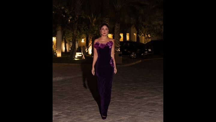 7. Kareena Kapoor: Kareena Kapoor looked stunning in a body hugging purple dress adorned with purple orchids. She kept her accessories minimal yet elegant, wearing a diamond ring and chandelier earrings. Her outfit gave her a luxurious and sophisticated look. (Image Source: Instagram/@kareenakapoorkhan)
