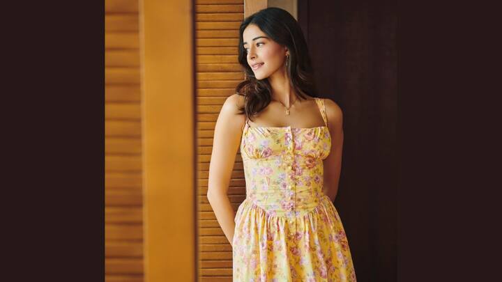 Ananya Pandey's chic look: Annya Pandey gives minimal accessories, soft makeup, and a sign of blush in a yellow floral dress in Ananya Pandey. (Image Source: Instagram/ Ananyapanday)