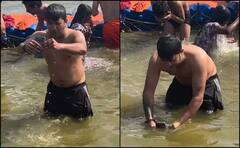 ‘મોબાઇલ પણ પાપનો ભાગીદાર છે’: મહાકુંભ સંગમમાં યુવકે ફોનને ‘મોક્ષ’ આપવા ડૂબકી લગાવી, video વાયરલ