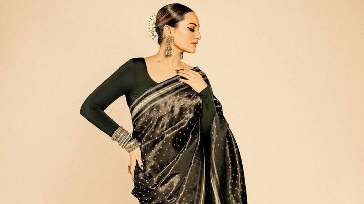 Exuding timeless charm, she wore a beautiful black and gold combination saree with heavy golden jewellery. A sleek bun adorned with jasmine flowers and bold makeup made her look every bit the royal. (Image Source: Instagram/ aslisona)
