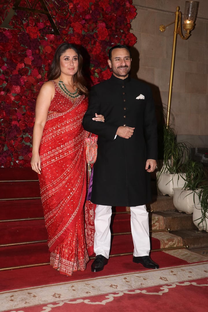 Kareena dazzled in a red saree with golden embroidery, emerald green jewelry, and a stylish potli bag.