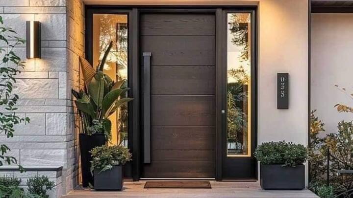 1. Wooden Decor Entrance Door Helps Invite Positive Energy: According to Vastu, a well-built wooden entrance door is considered good. Also, it serves as a protective shield from negative energies and provides aid to prosperity and good fortune. Choose solid wood doors made of teak or oak, and make sure that they open up in a clockwise manner to draw in good energetic vibrations. (Image Source: Pinterest/nfabiangarcia)