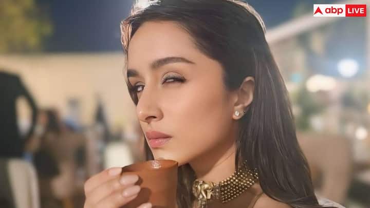 He completed his look with golden elephant bran necklace, stud earrings, bangles adorned on the wrist and champagne Gold Glass-Beed Bag which was complementing his dress completely.